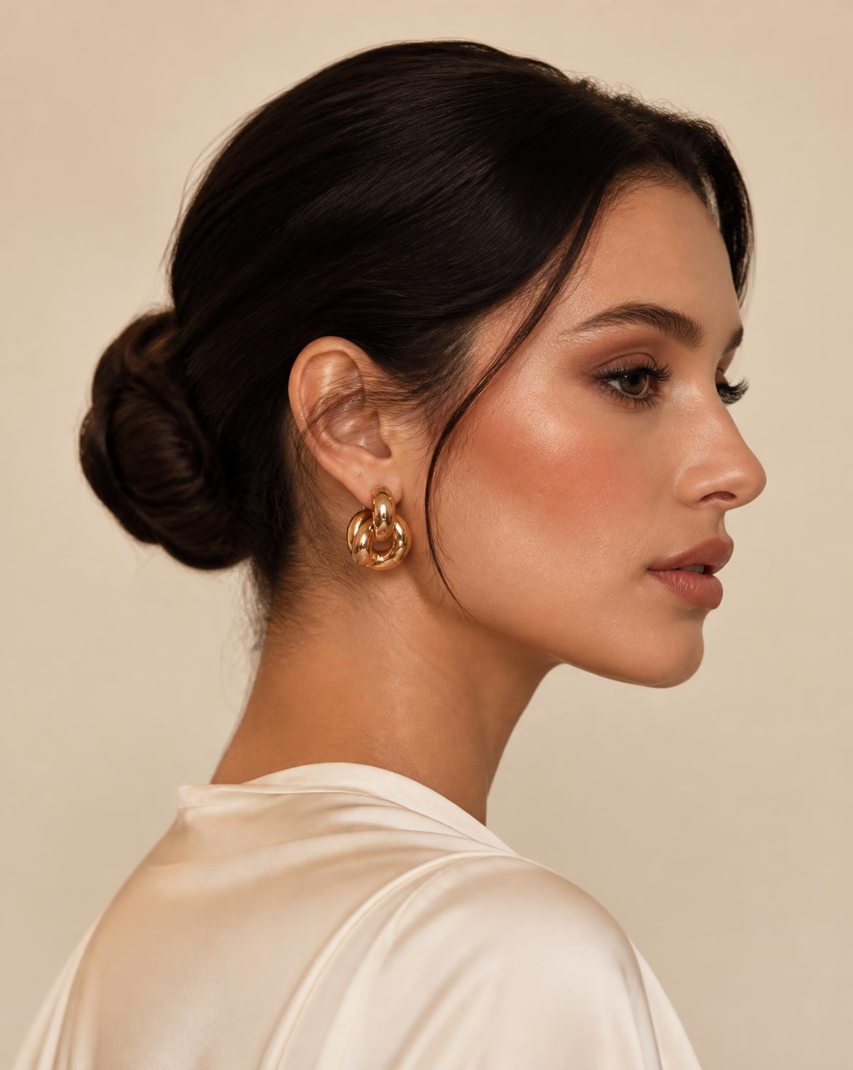Sleek low chignon styled for an evening event